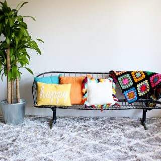Wire bench with gray rug