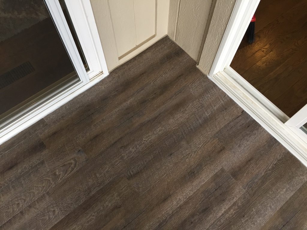 exterior vinyl floor decking for a screened in porch corner